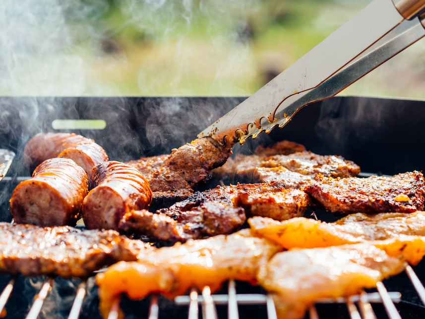 Person Grilling Meats